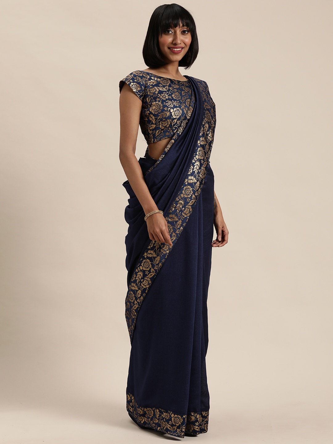 

Mitera Navy Blue & Gold-Toned Solid Saree