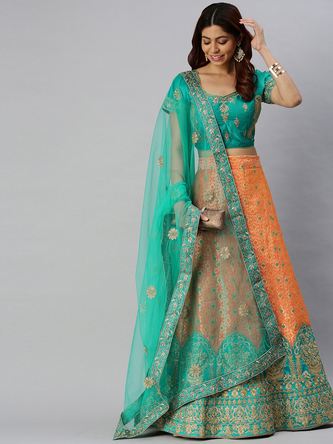 

Mitera Teal Green & Orange Semi-Stitched Lehenga & Unstitched Blouse with Dupatta