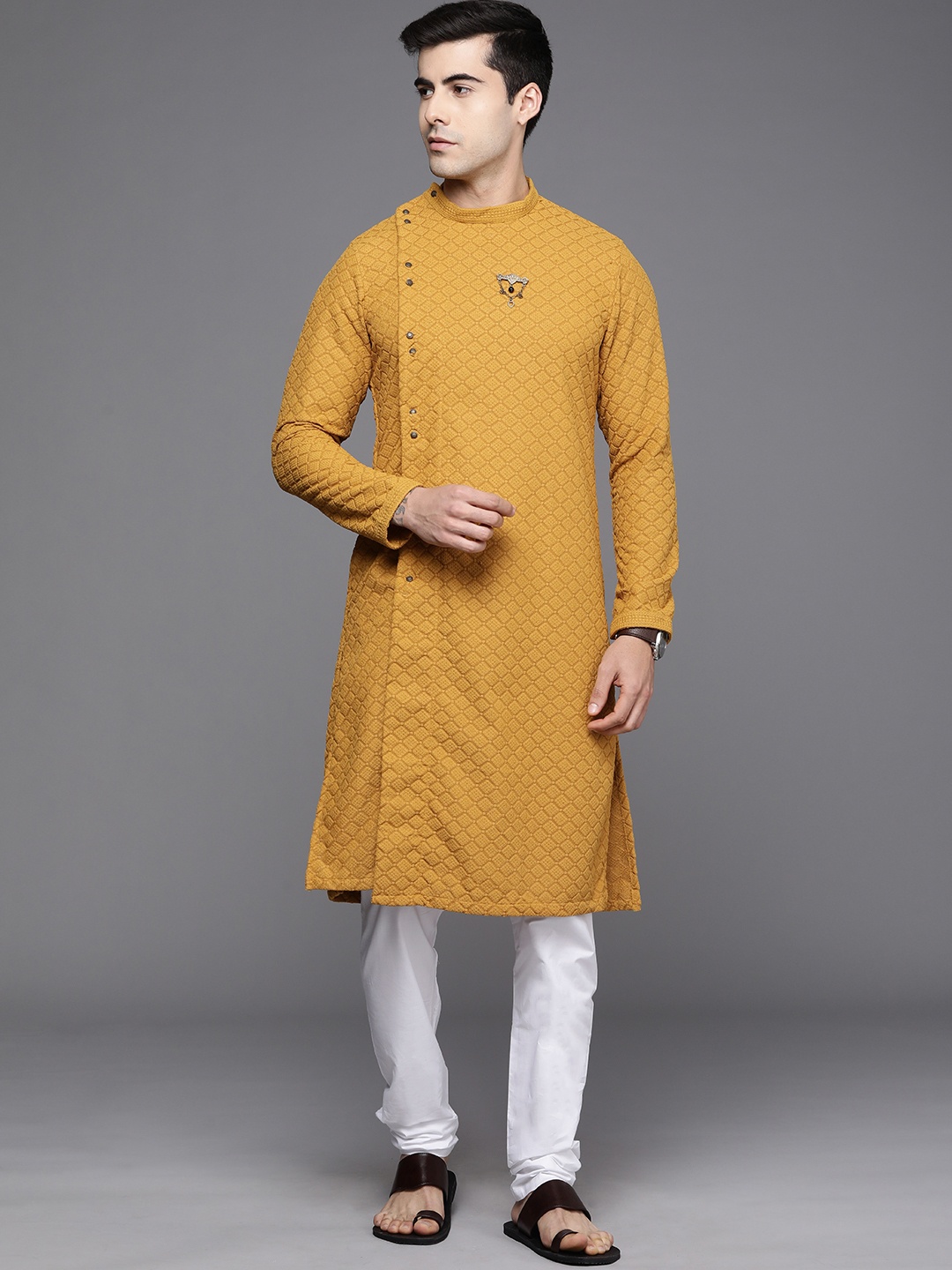 

Manyavar Men Orange & White Ethnic Motifs Embroidered Kurta with Churidar