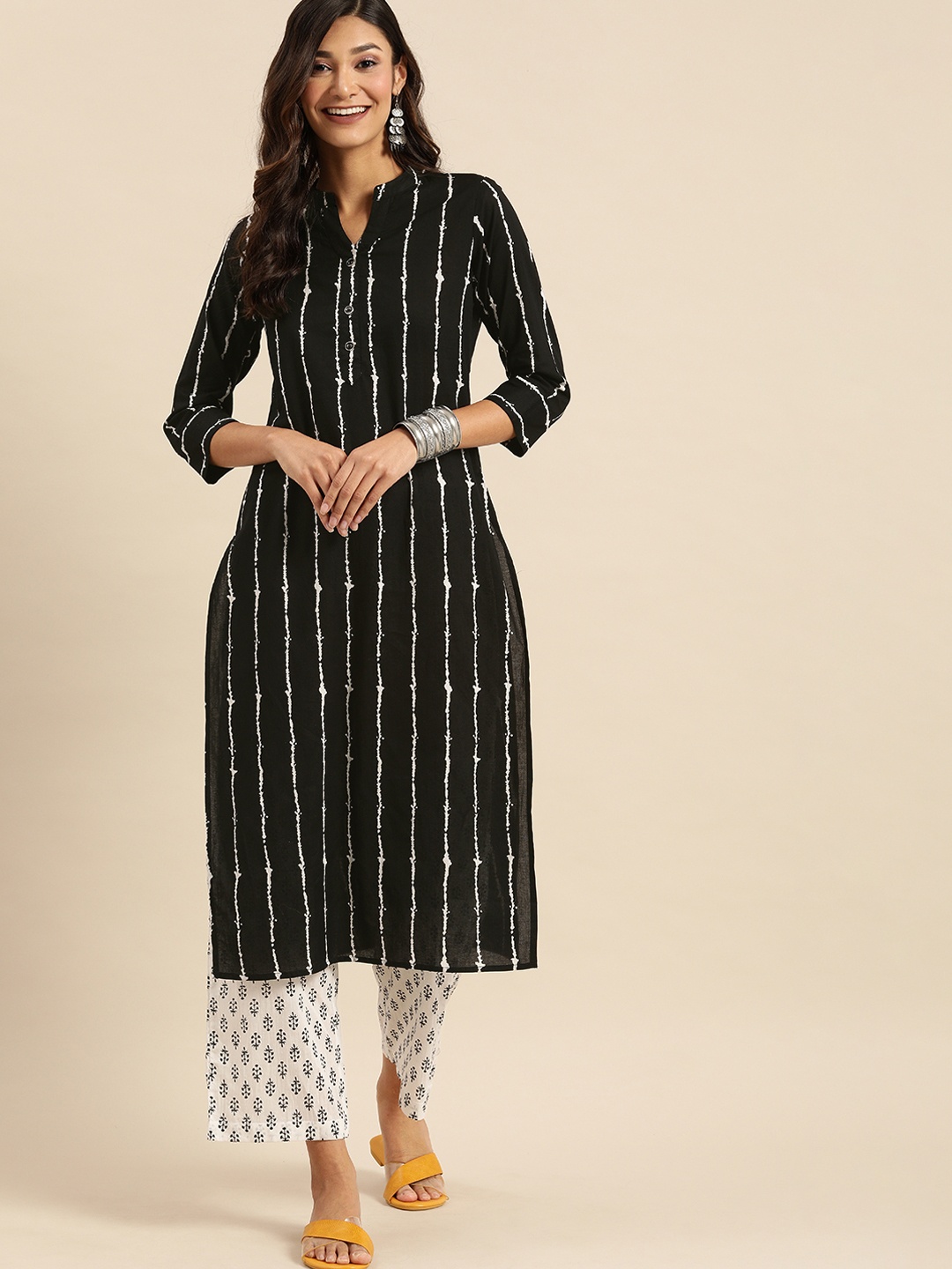 

Rajnandini Women Black & White Pure Cotton Striped Kurta with Palazzos