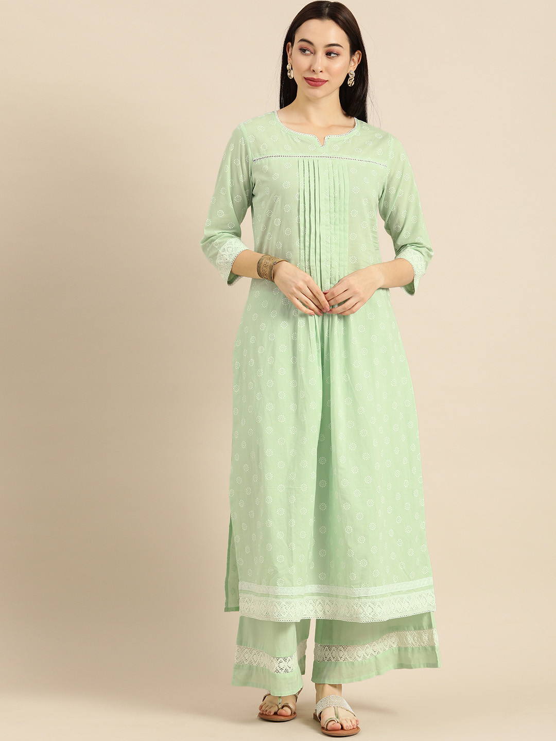 

Varanga Women Sea Green & White Printed Kurta with Palazzos