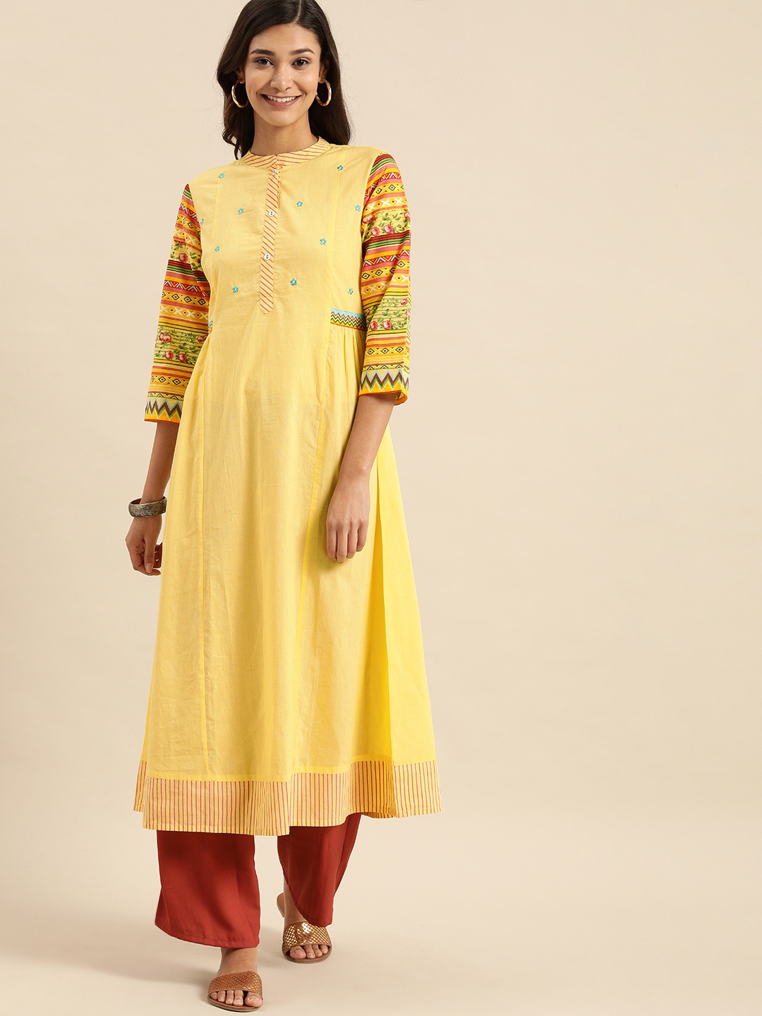 

Varanga Women Yellow Tribal Printed Thread Work Pure Cotton Kurta