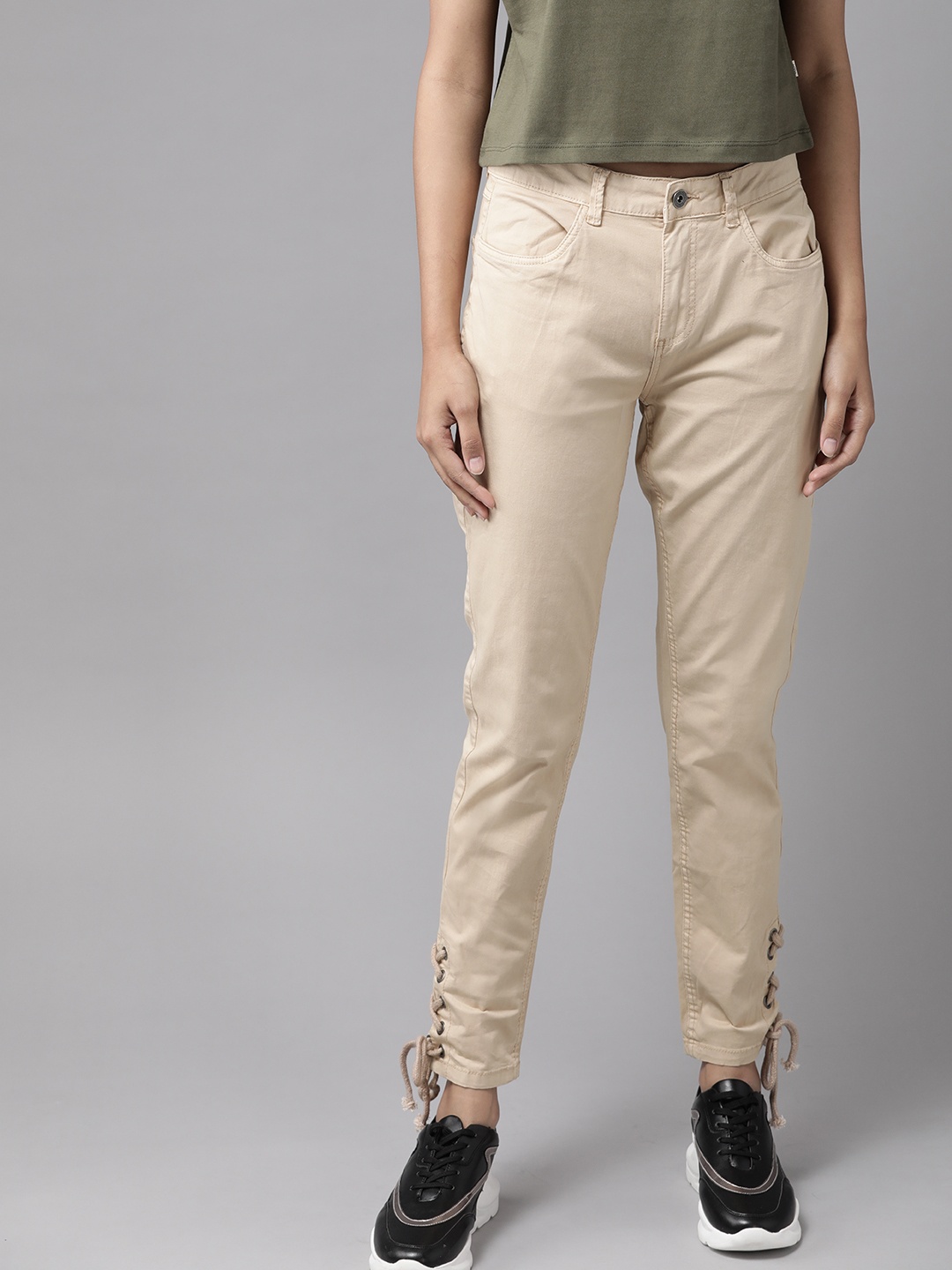 

The Roadster Lifestyle Co Women Beige Skinny Fit Solid Regular Trousers