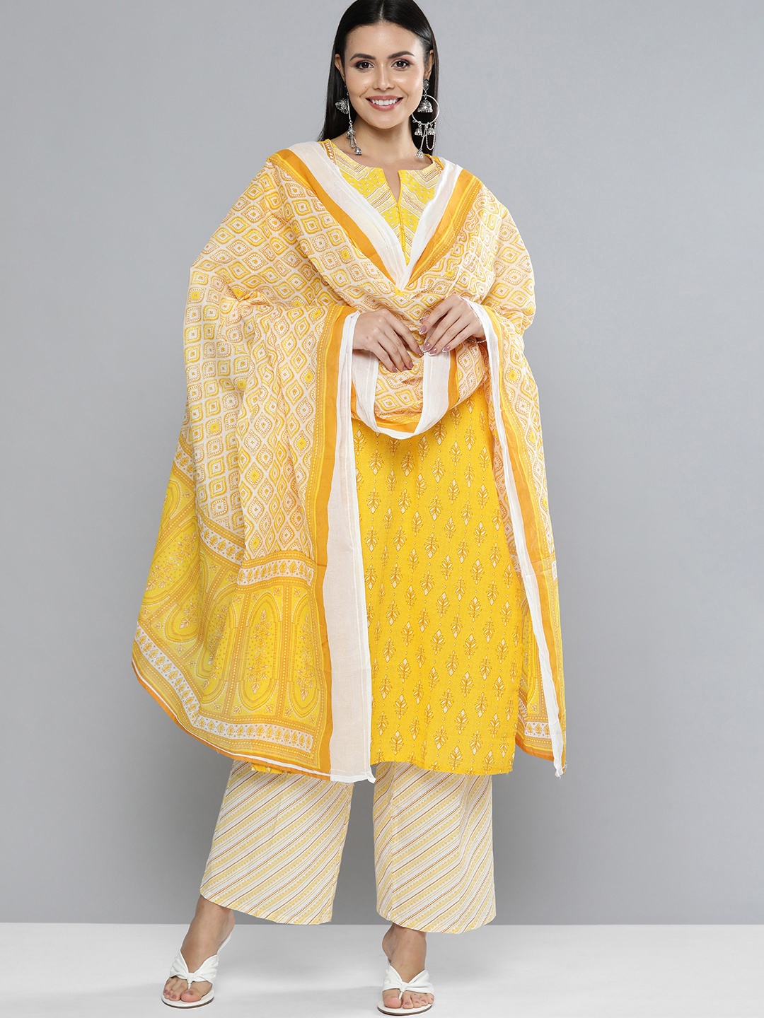 

Vishudh Women Yellow & Off-White Printed Kurta with Trousers & Dupatta