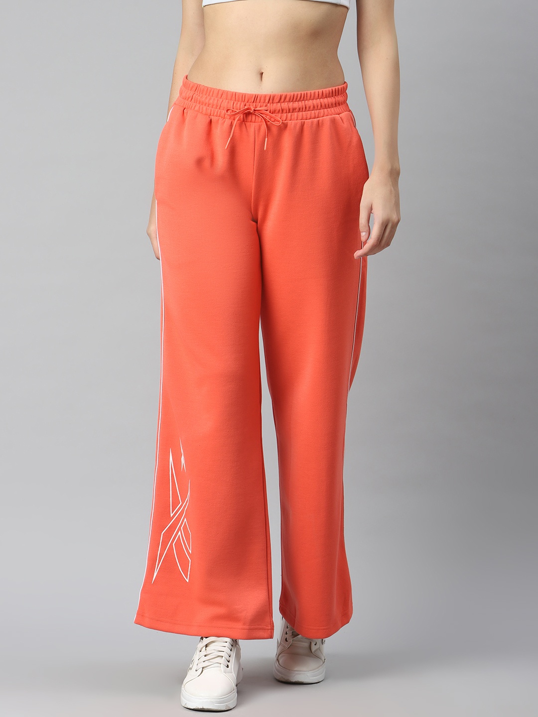 

Reebok Women Orange Brand Logo Print Training MYT Track Pants