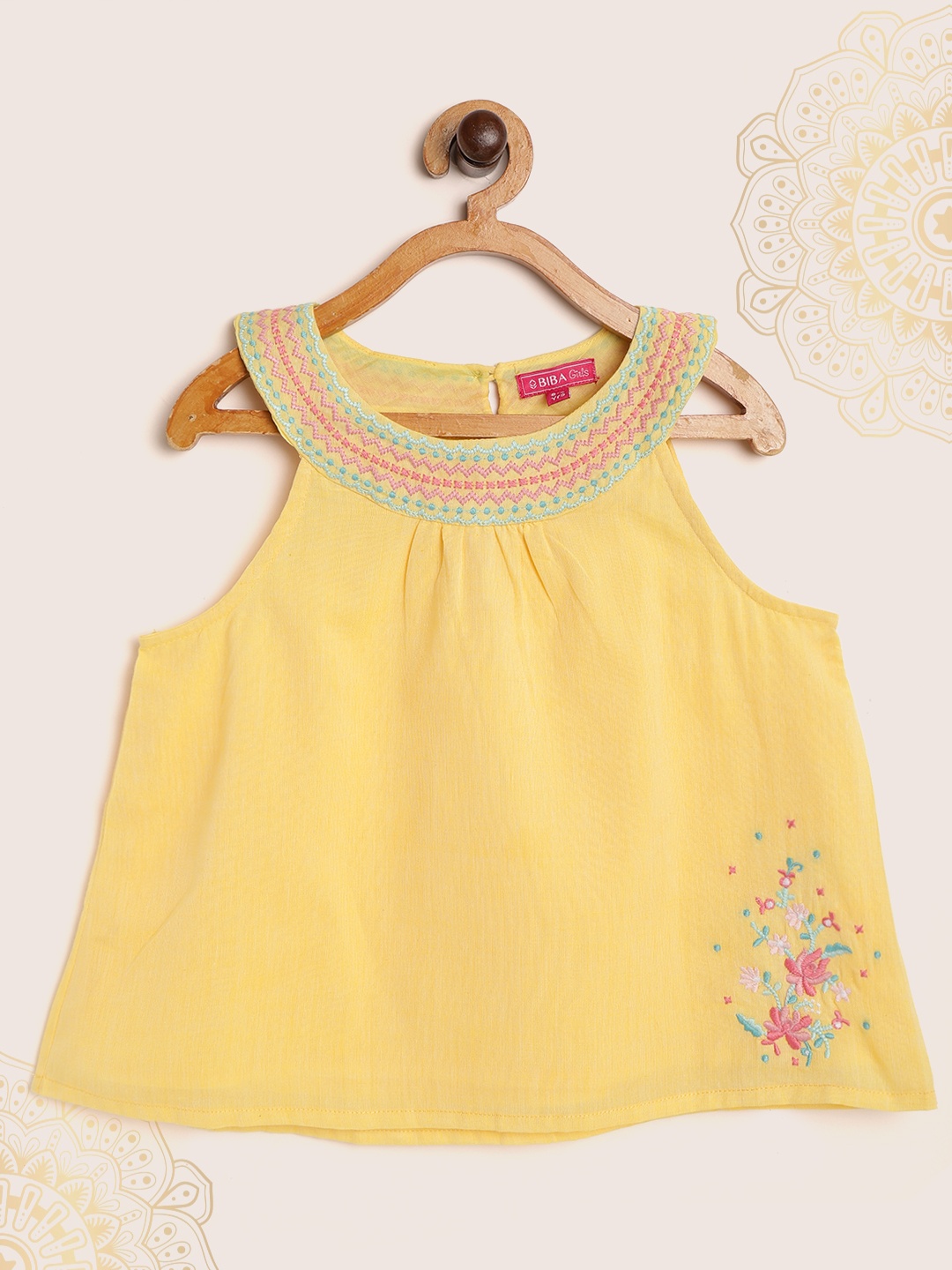 

Biba Girls Yellow Solid Round Neck Pure Cotton A-line Top
