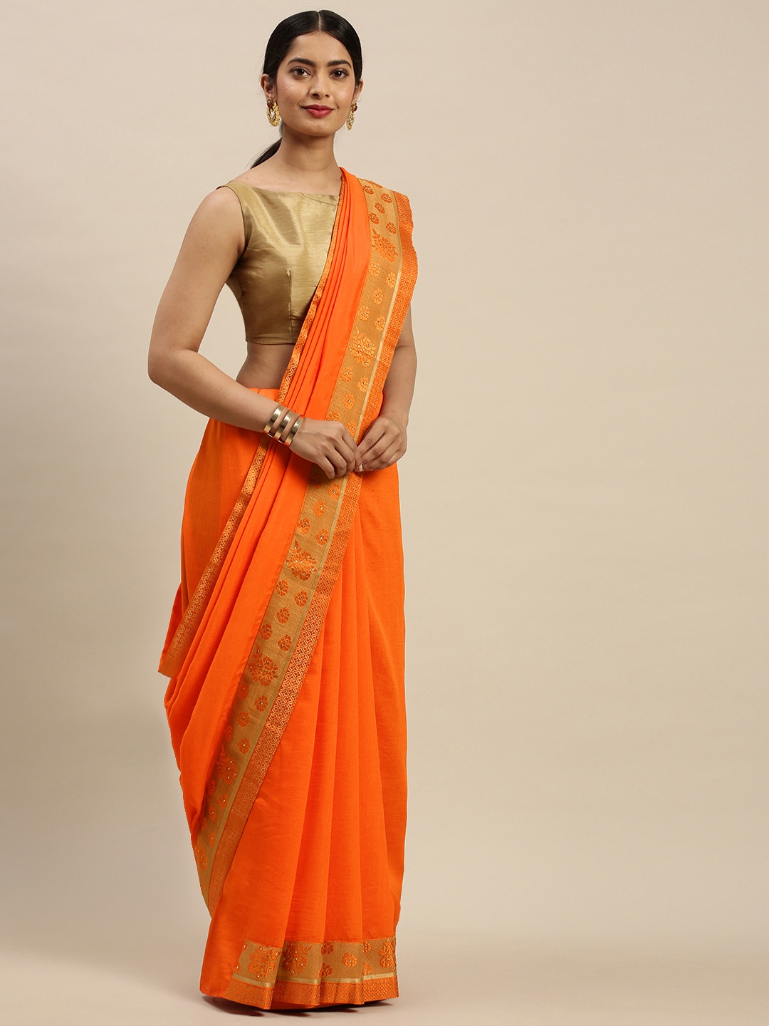 

Indian Women Orange Solid Saree