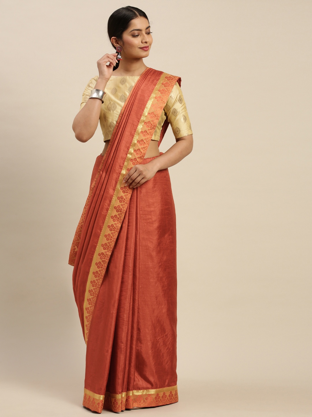 

Indian Women Orange Solid Saree