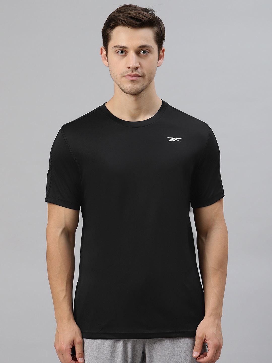 

Reebok Men Black Solid Round Neck T-shirt