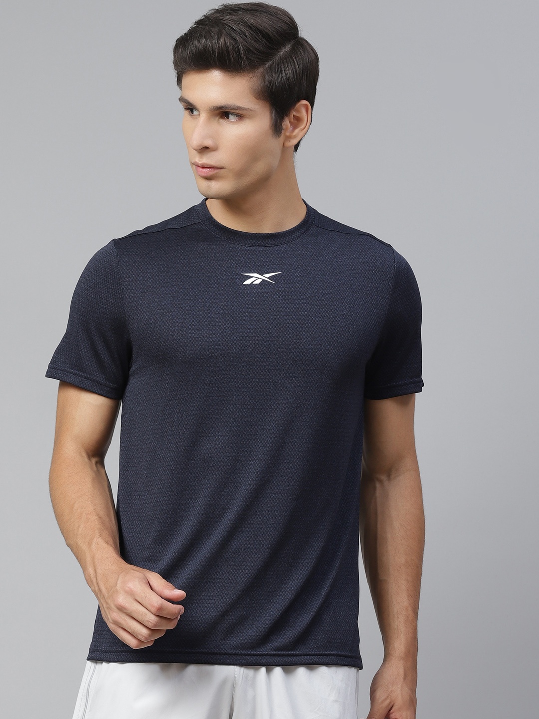 

Reebok Men Navy Blue Solid Training Workout Ready Melange Tee