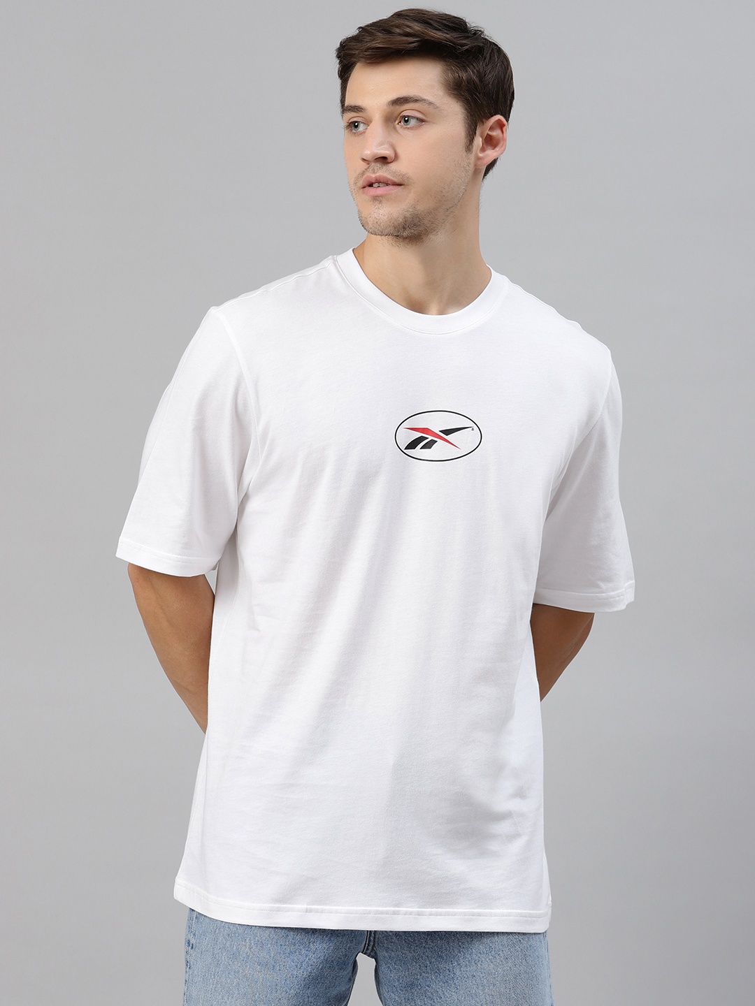 

Reebok Classic Unisex White Glitch Brand Logo Printed Back Round Neck T-shirt