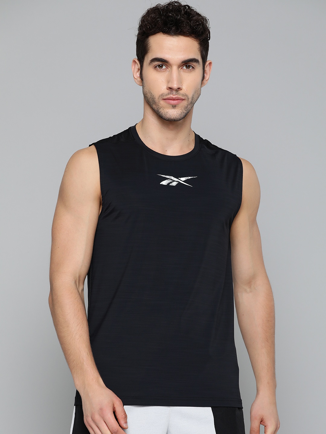 

Reebok Men Black Work Out Ready Activchill Sleeveless Solid Training T-Shirt