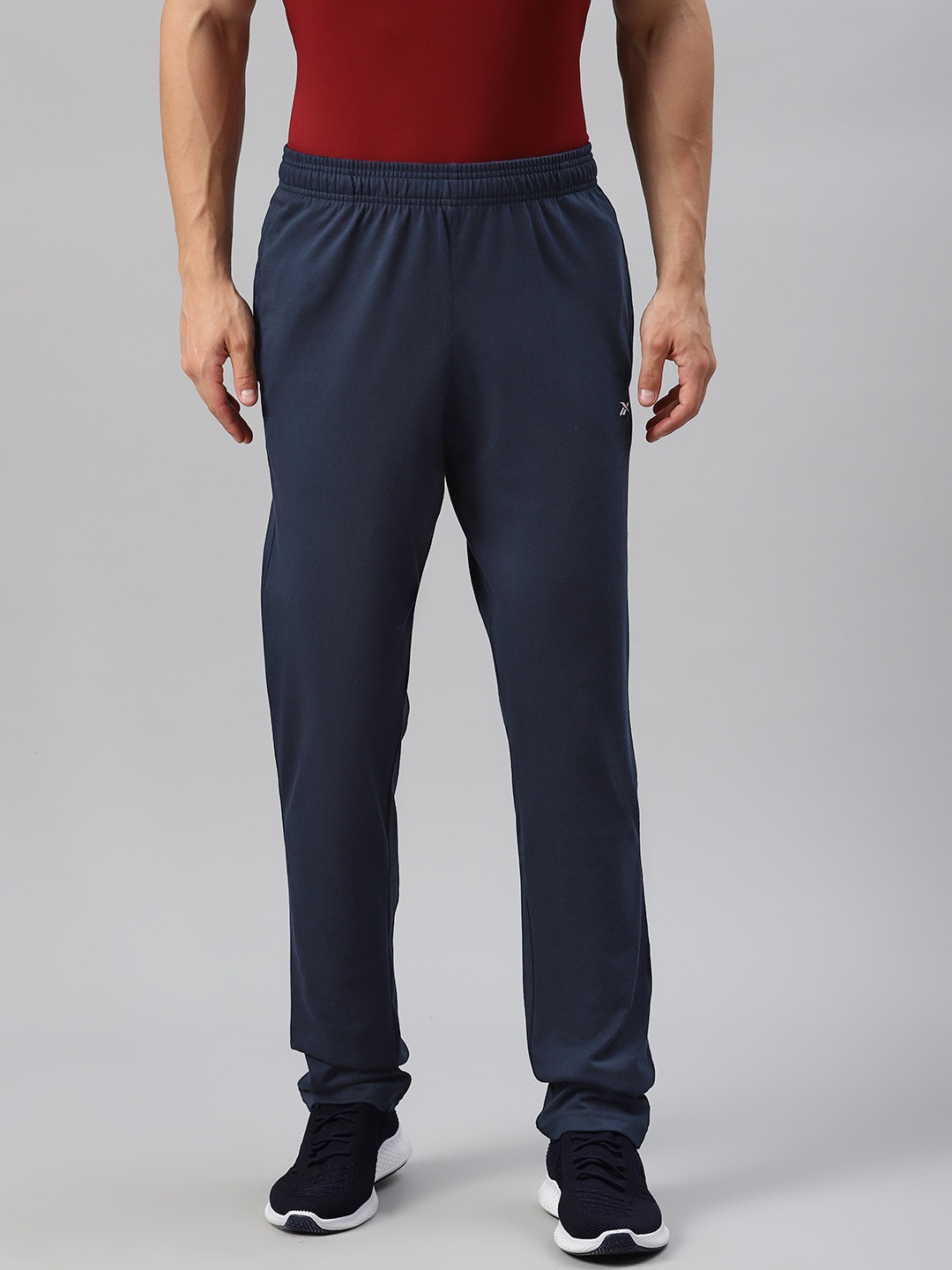 

Reebok Men Navy Blue Solid Regular Fit TE Vec Pure Cotton Track Pant