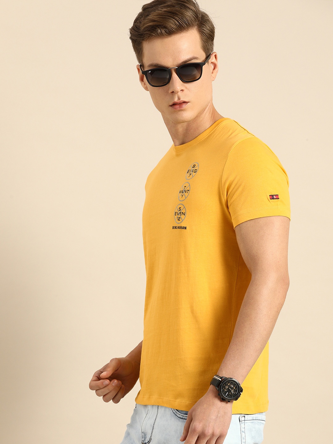 

Being Human Men Mustard Yellow Solid Round Neck Pure Cotton T-shirt with Logo Print