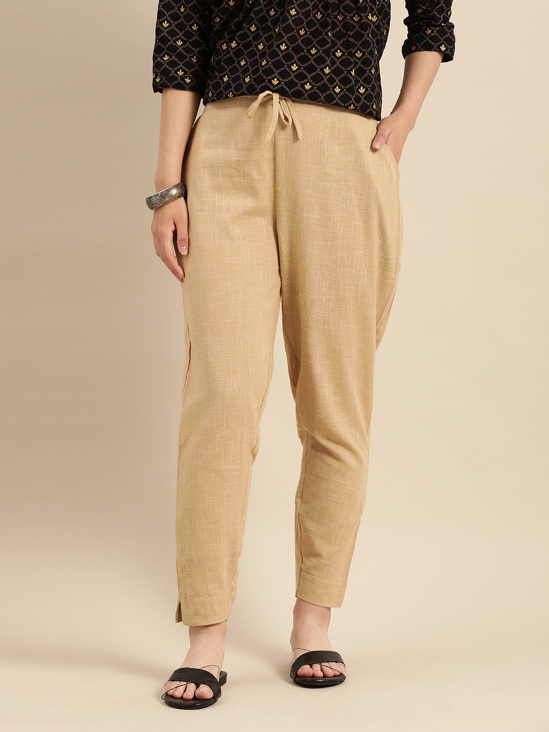 

Rajnandini Women Camel Brown Relaxed Straight Leg Solid Regular Trousers