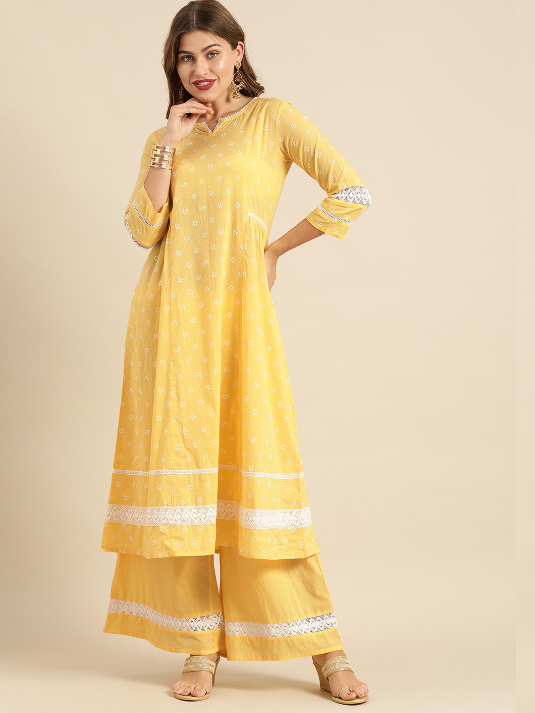 

Varanga Women Yellow & White Printed Kurta with Palazzos