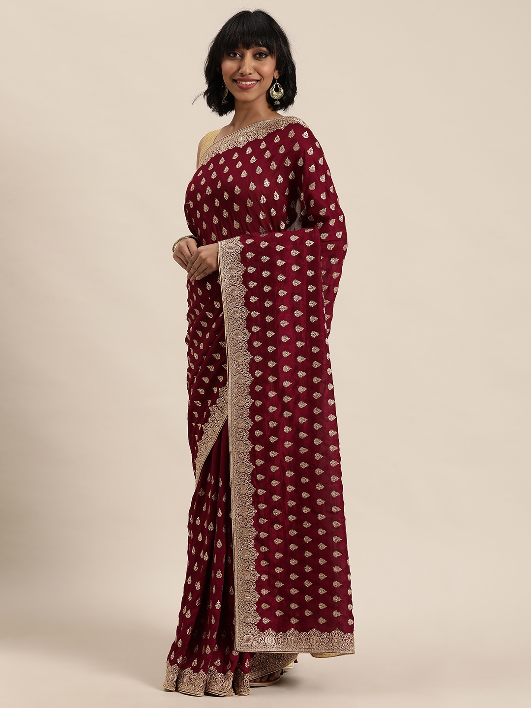 

MOHEY Maroon & Golden Embroidered Saree