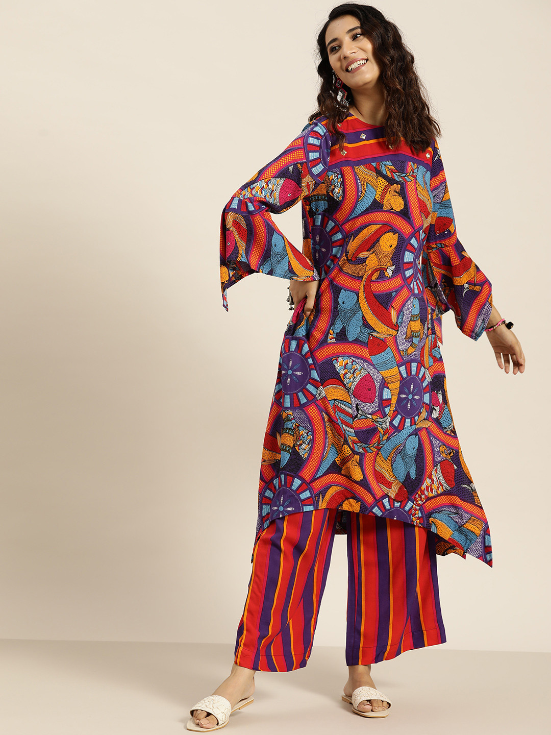 

Sangria Women Purple & Orange Quirky Print Mirror Work High-Low Straight Kurta & Palazzos