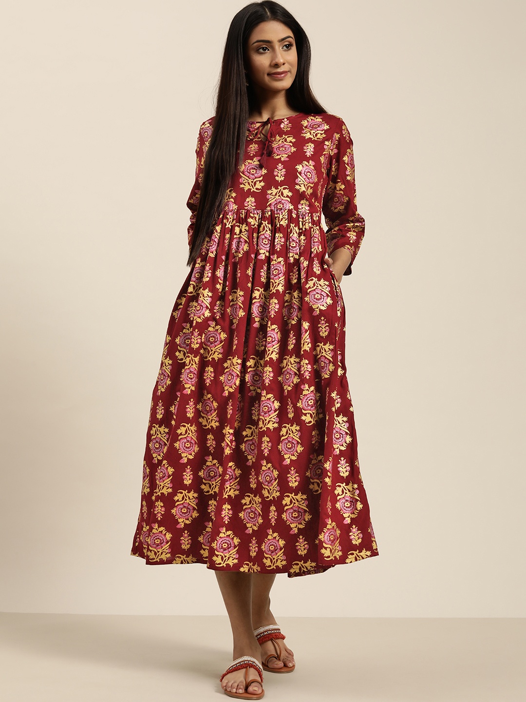 

Sangria Women Maroon & Golden Pure Cotton Printed A-Line Dress With Tie-Up Neck