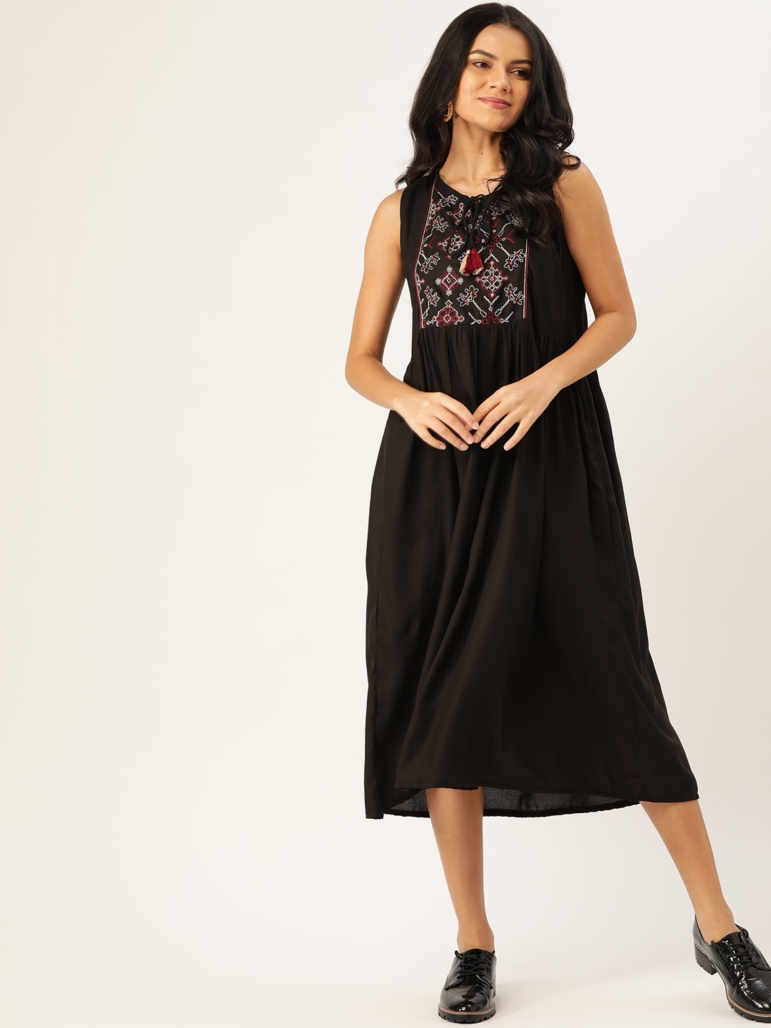 

Sangria Women Black Solid A-Line Dress With Printed Yoke Design
