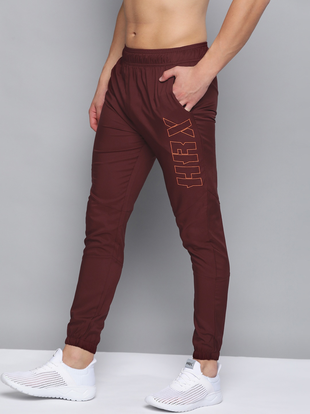 

HRX By Hrithik Roshan Men Zinfandel Solid Slim Fit Rapid-Dry Antimicrobial Anti-Static Training Track Pants, Burgundy