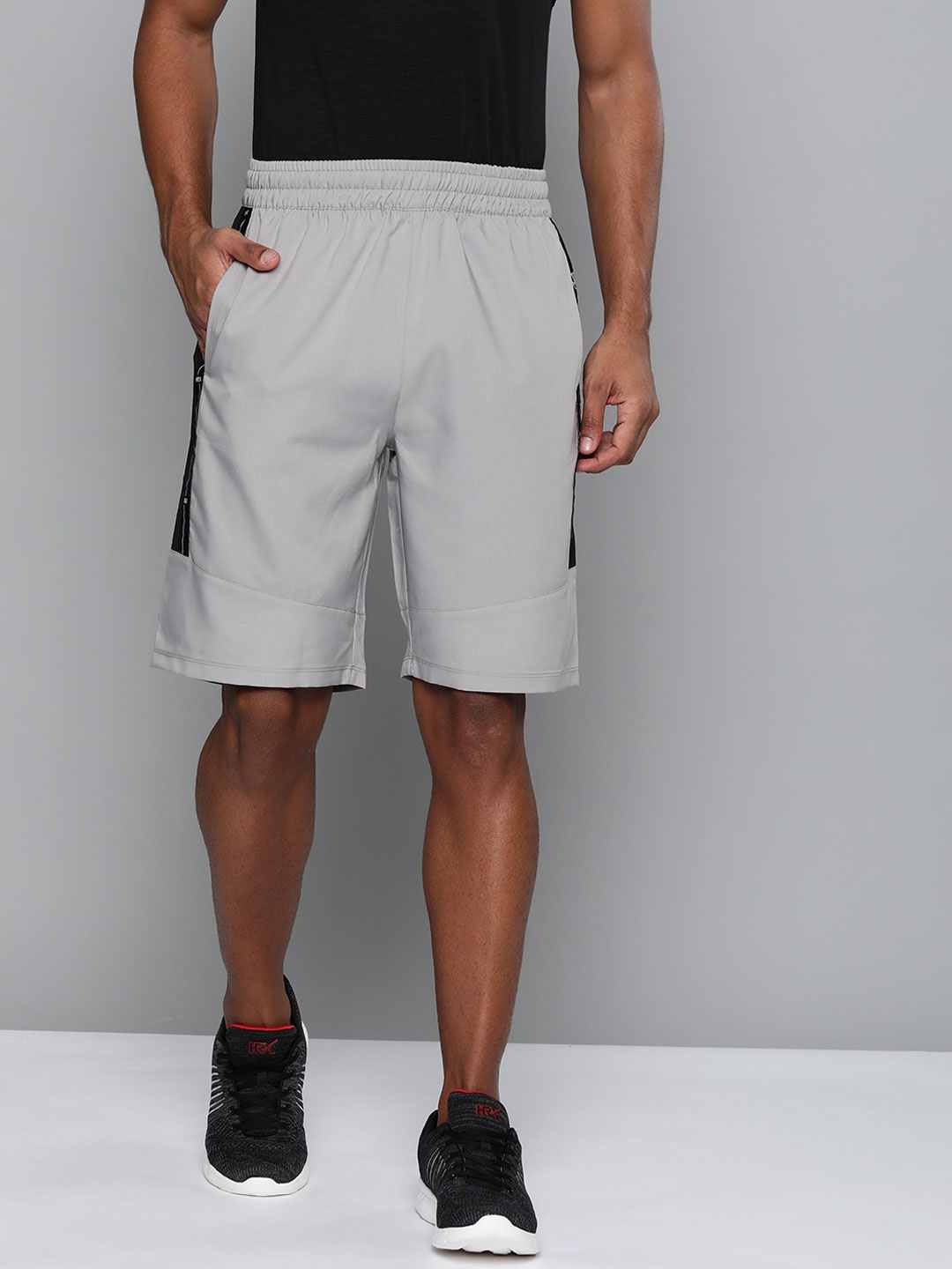 

HRX By Hrithik Roshan Men Wet Weather , Jet Black Colourblock Regular Fit Mid-Rise Rapid-Dry Antimicrobial Training Shorts, Grey