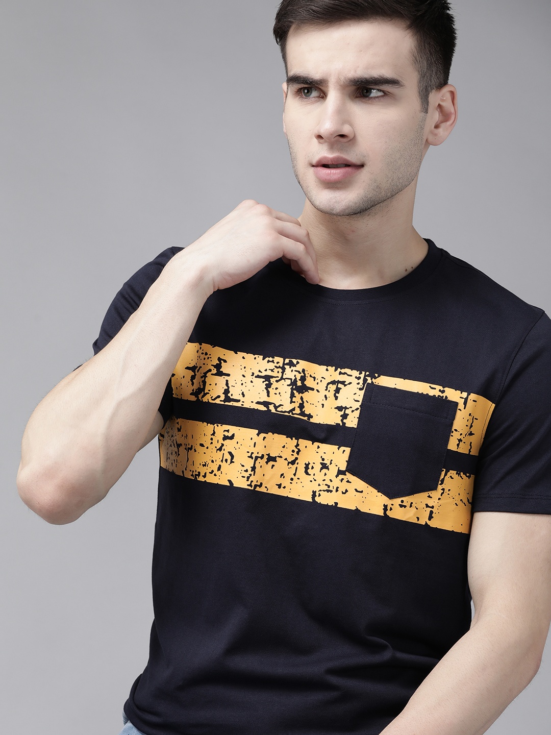 

The Roadster Lifestyle Co Men Navy Blue & Yellow Pure Cotton Striped Pocket Detailing T-shirt