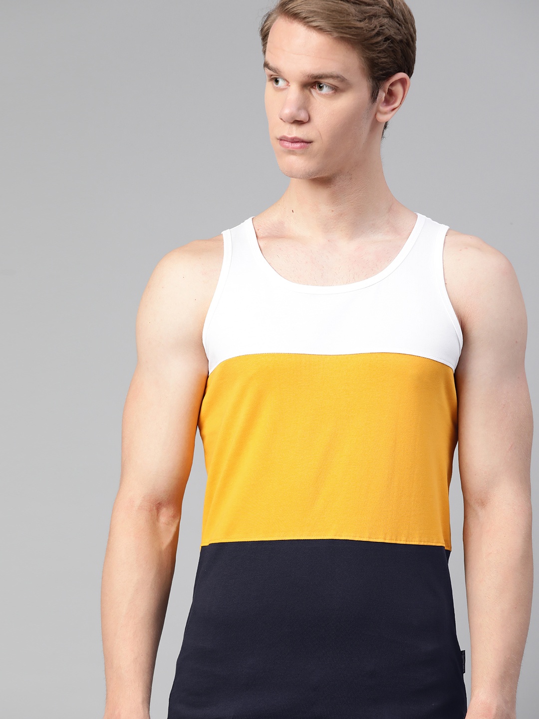 

The Roadster Lifestyle Co Men Mustard Navy Blue Colourblocked Pure Cotton T-shirt