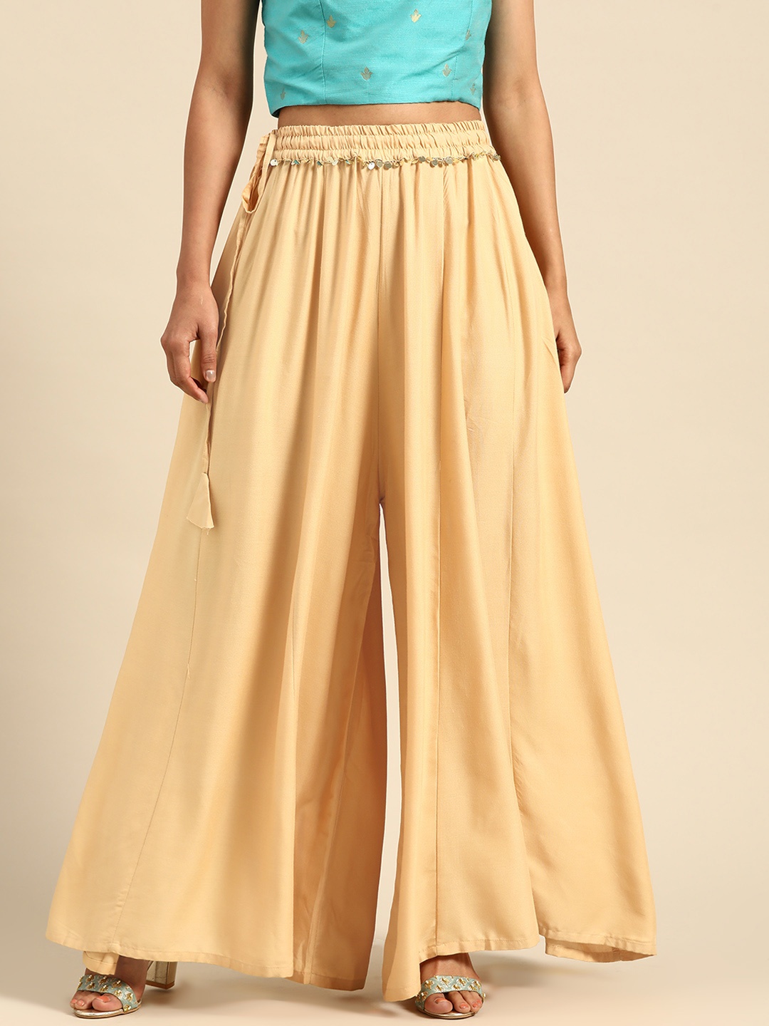 

TAG 7 Women Beige Solid Flared Palazzos