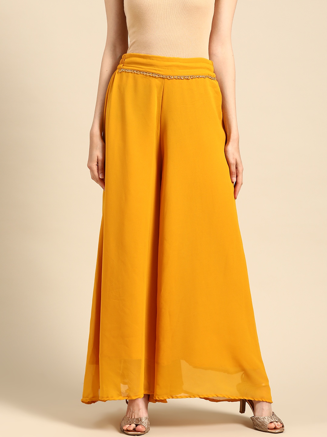 

TAG 7 Women Mustard Yellow Solid Flared Palazzos
