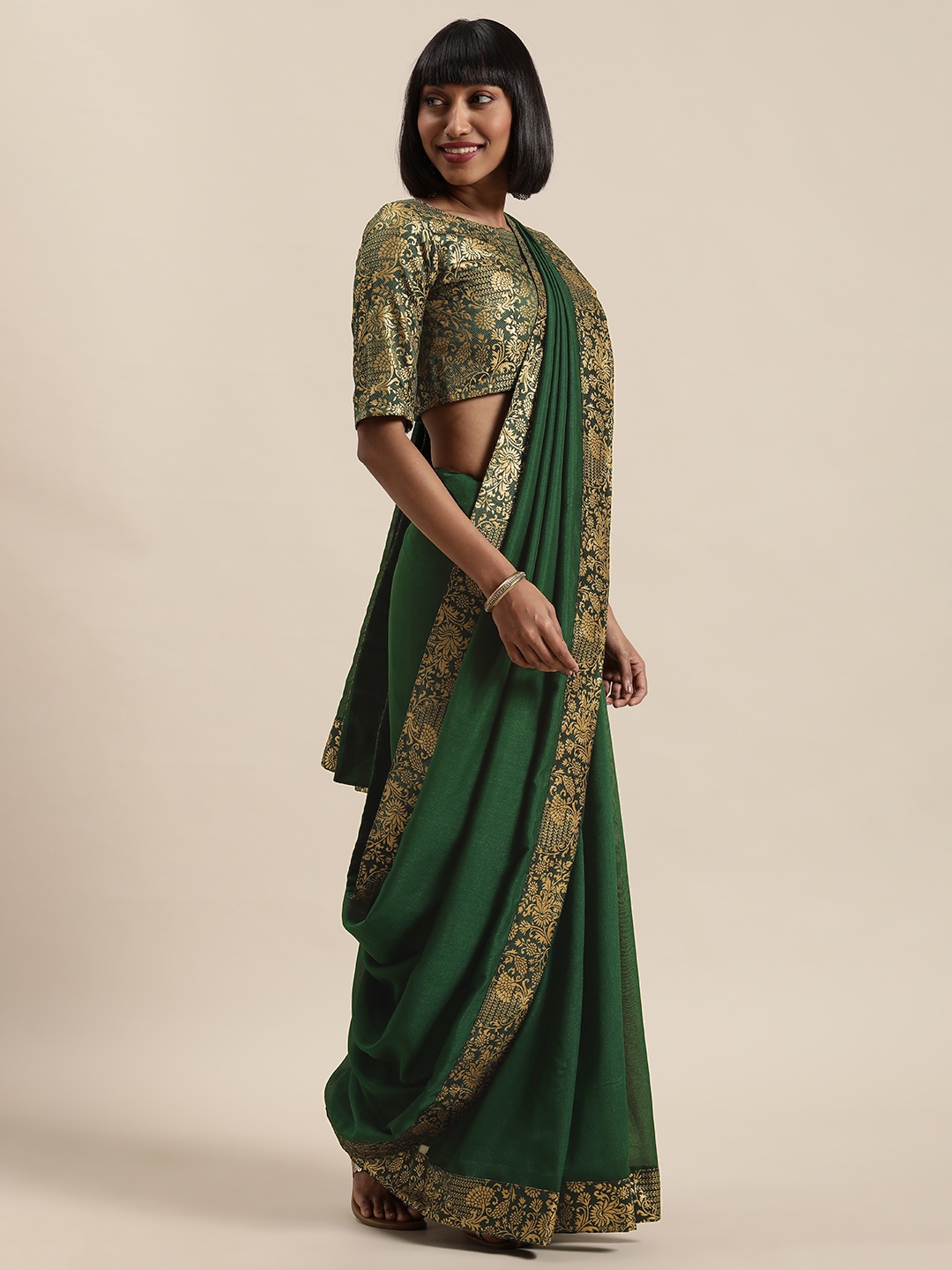 

Shaily Green & Gold-Toned Silk Blend Solid Zari Border Saree