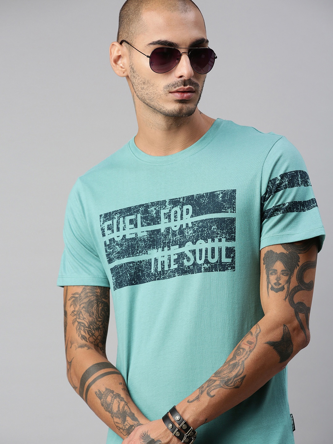 

The Roadster Lifestyle Co Men Green Black Typography Printed Pure Cotton T-shirt