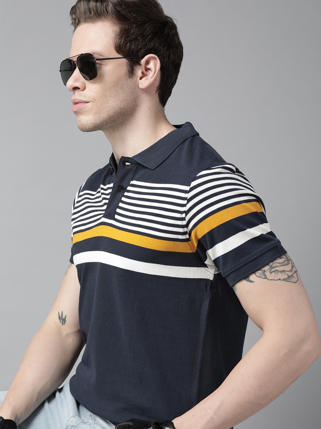 

Roadster Men Navy Blue & White Striped Polo Collar Pure Cotton T-shirt