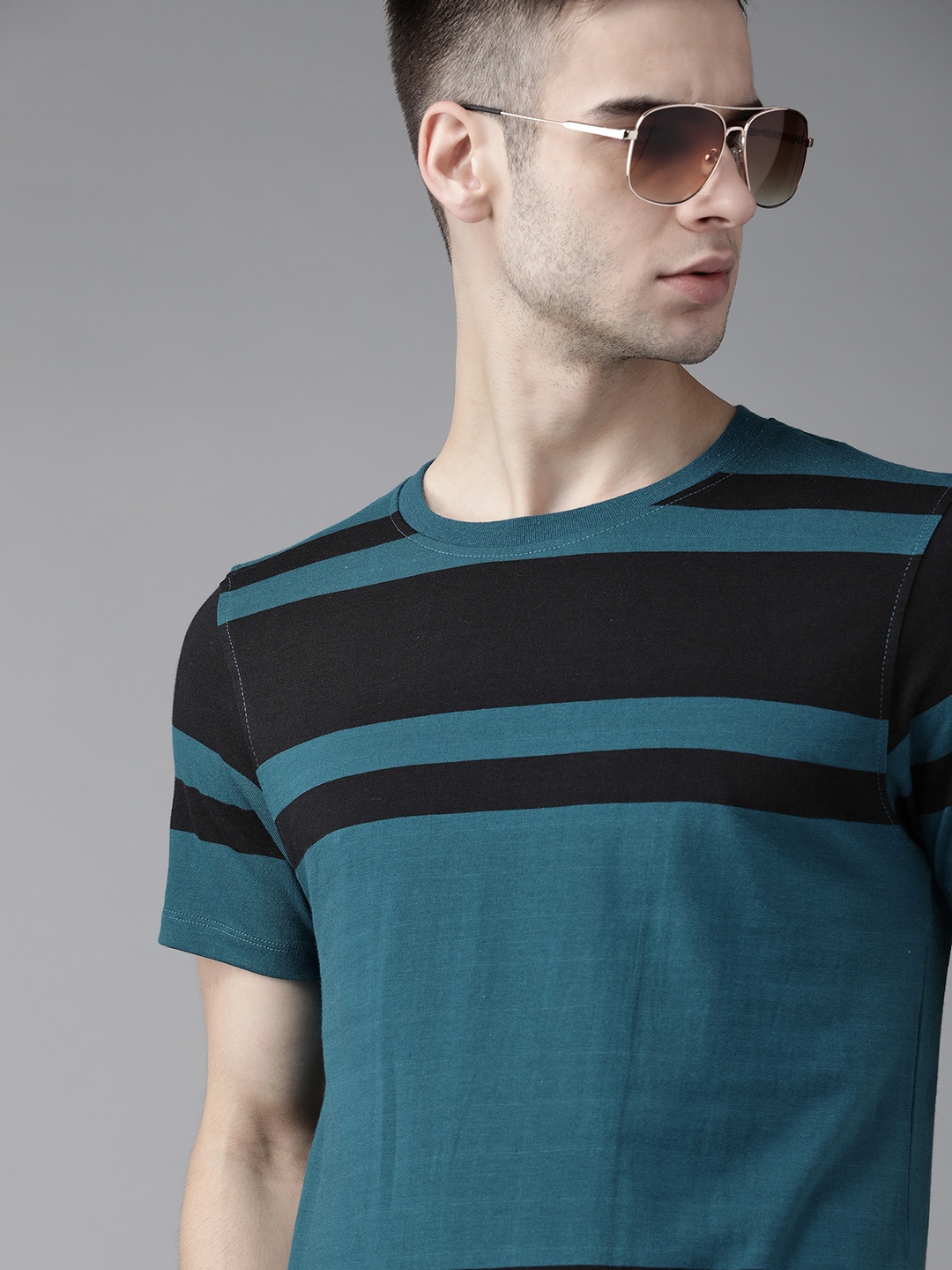 

The Roadster Lifestyle Co Men Teal Blue Black Striped Pure Cotton T-shirt