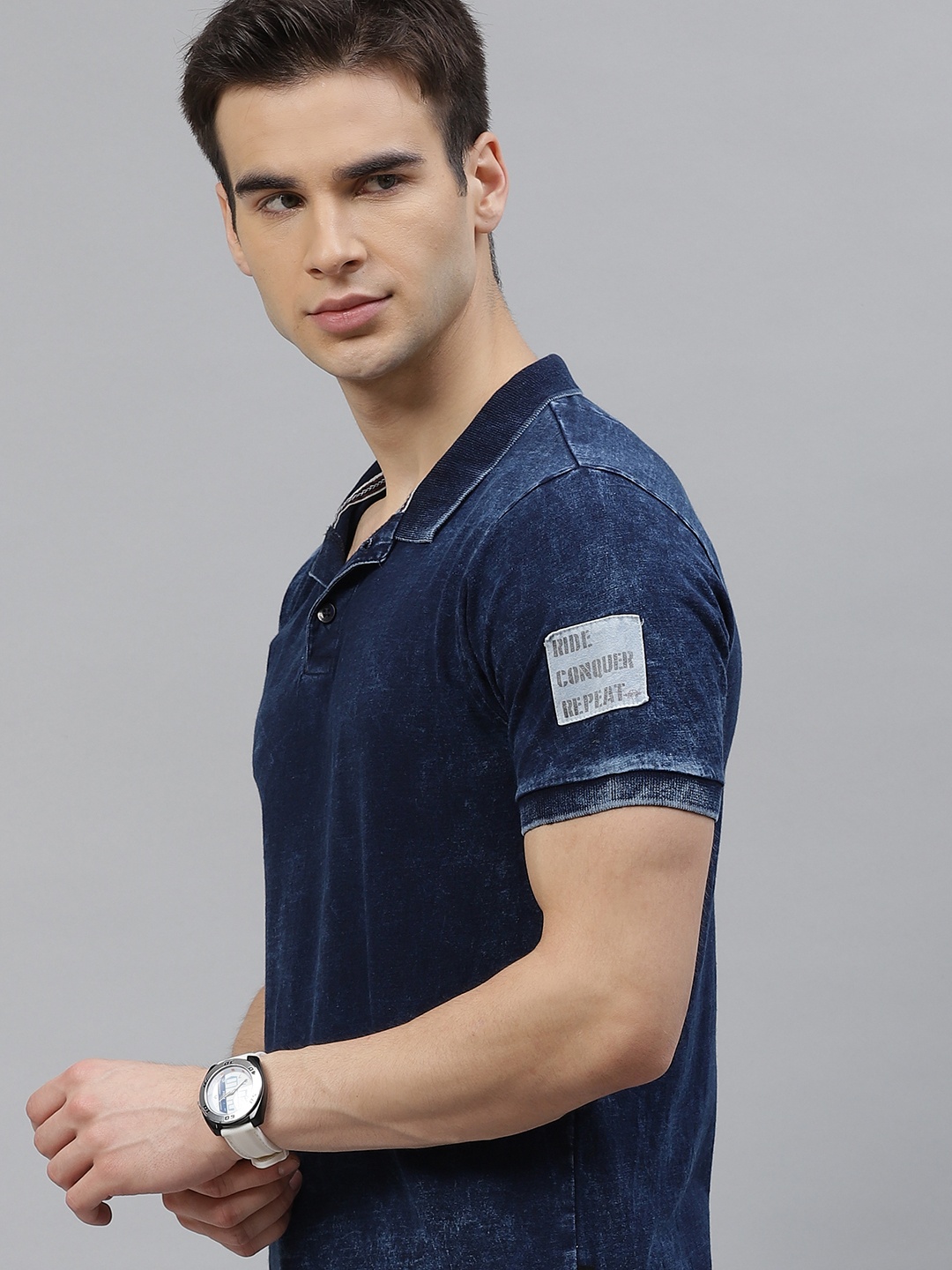 

The Roadster Lifestyle Co Men Navy Blue Pure Cotton Dyed Polo Collar Denim T-shirt