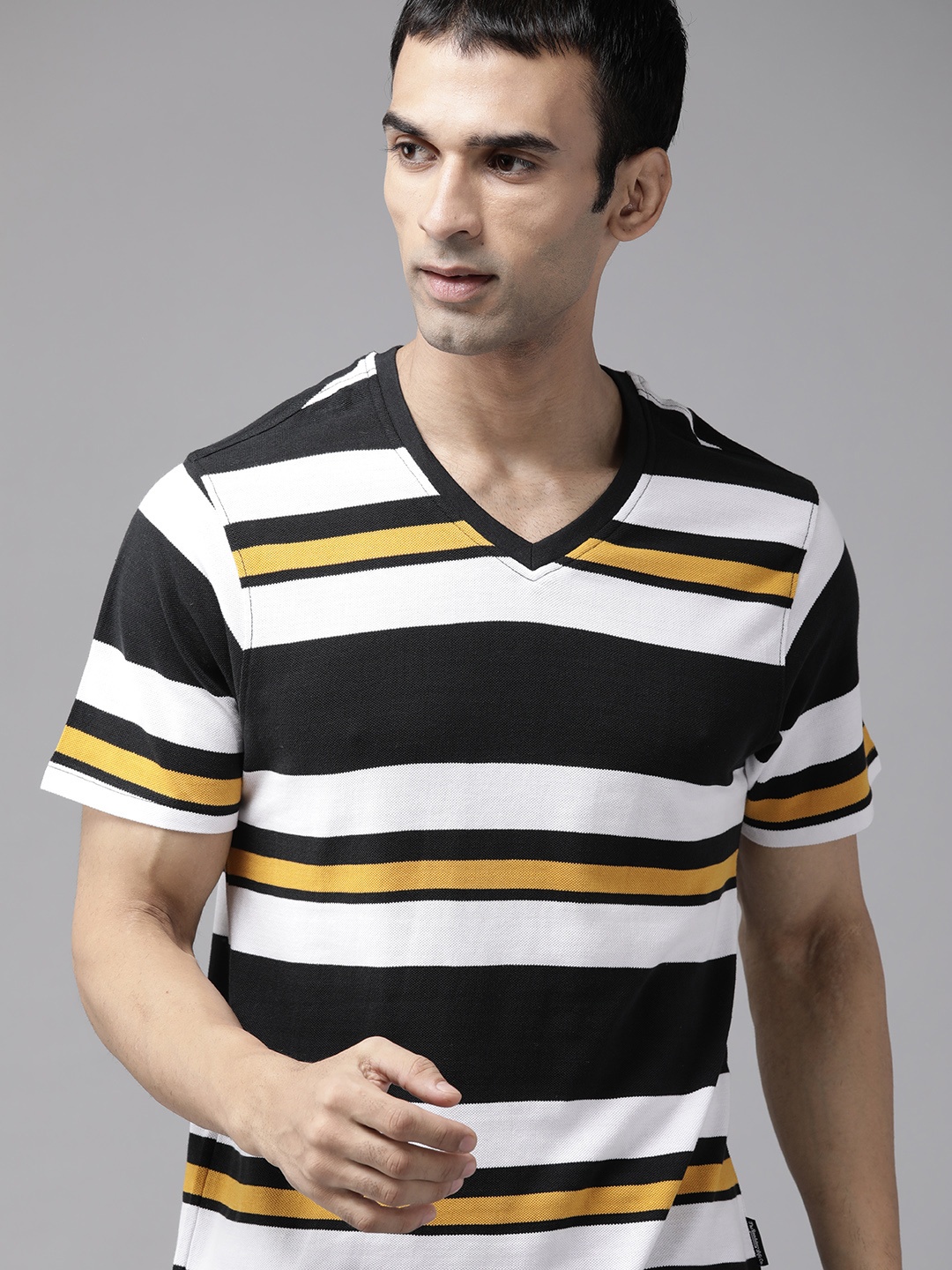 

The Roadster Lifestyle Co Men White & Black Pure Cotton Striped V-Neck T-shirt