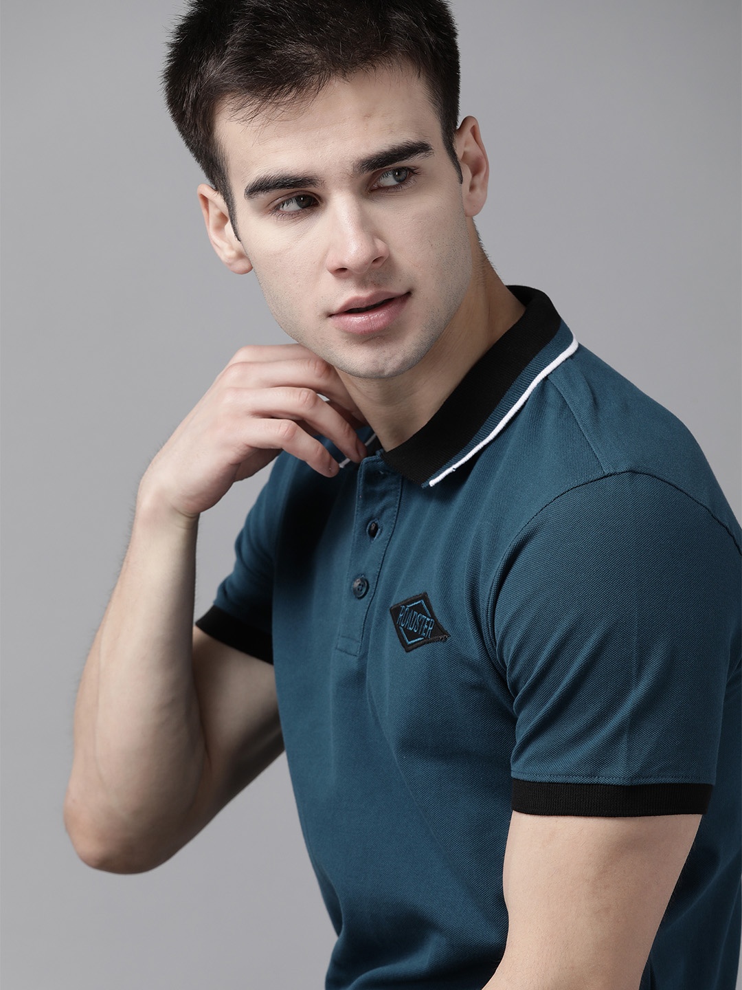 

The Roadster Lifestyle Co Men Teal Blue Pure Cotton Solid Polo Collar Pure Cotton T-shirt