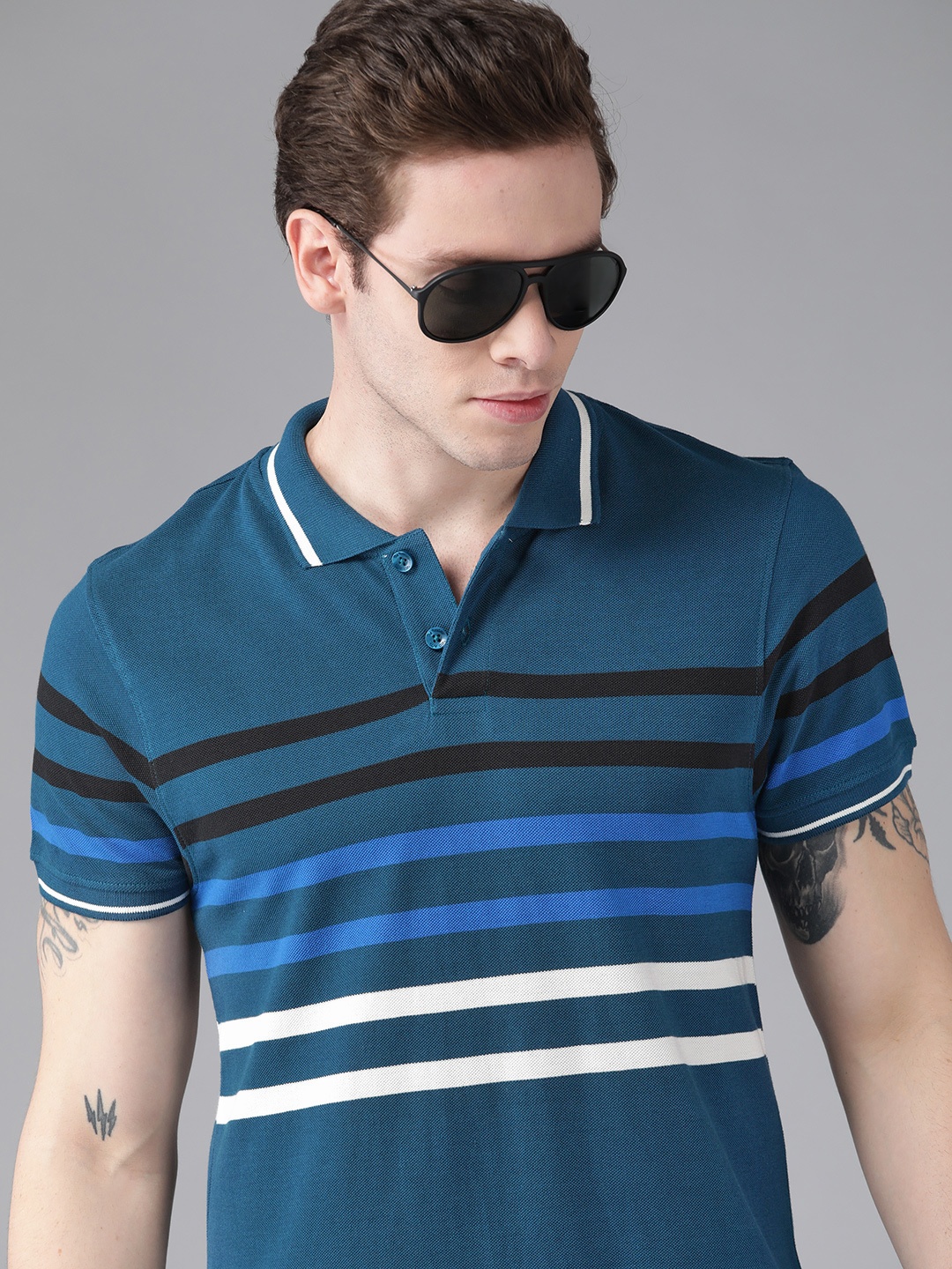 

Roadster Men Teal Blue Pure Cotton Striped Polo Collar T-shirt