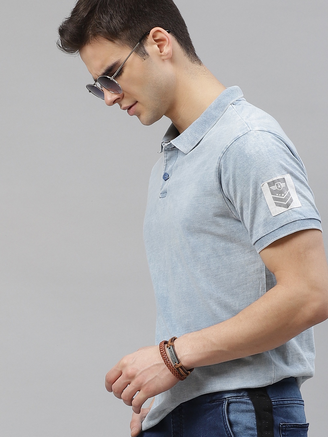 

The Roadster Lifestyle Co Men Blue Solid Pure Cotton Polo Collar Pure Cotton T-shirt