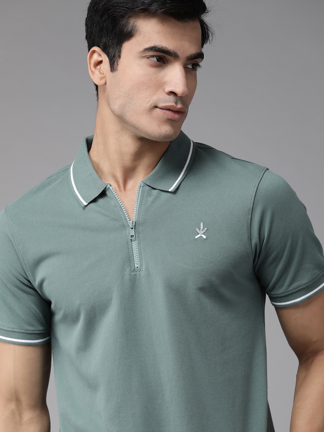 

The Roadster Lifestyle Co Men Green Solid Cotton Polo Collar T-shirt