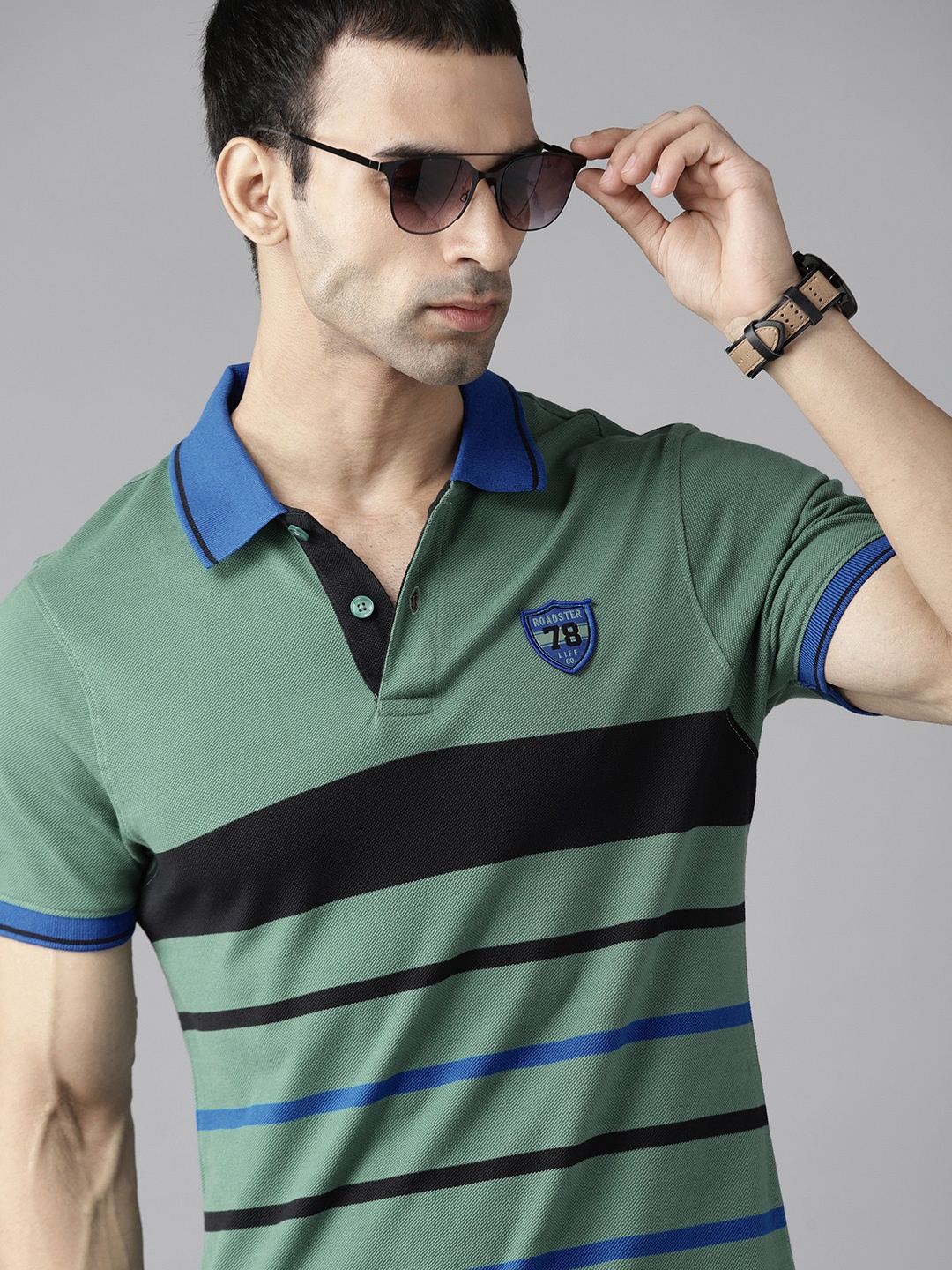 

The Roadster Lifestyle Co Men Green & Black Striped Polo Collar Pure Cotton T-shirt