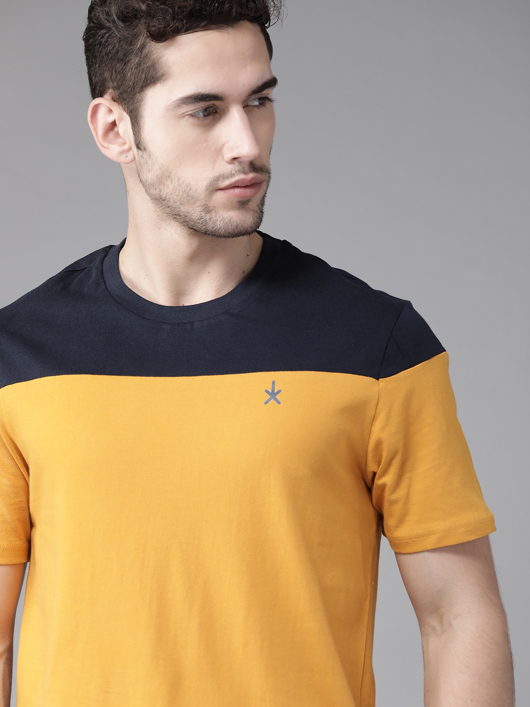 

The Roadster Lifestyle Co Men Mustard Yellow & Navy Blue Pure Cotton Colourblocked Round Neck T-shirt