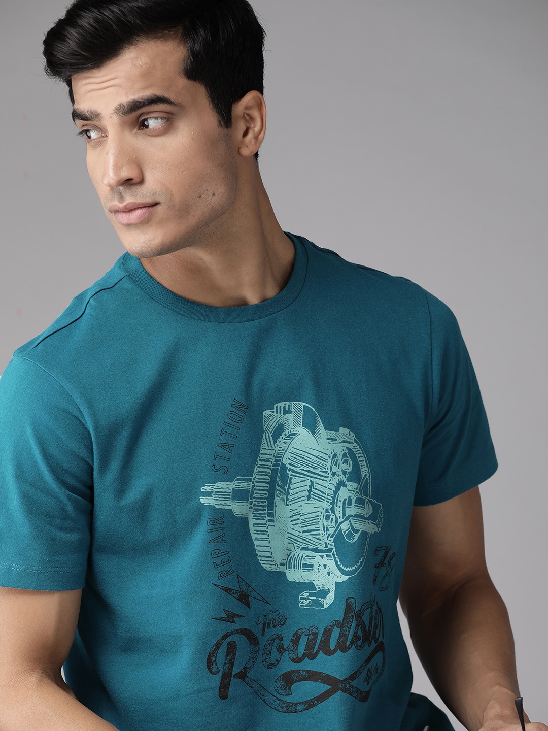 

The Roadster Lifestyle Co Men Teal Blue White Brand Logo Print Round Neck Pure Cotton T-shirt