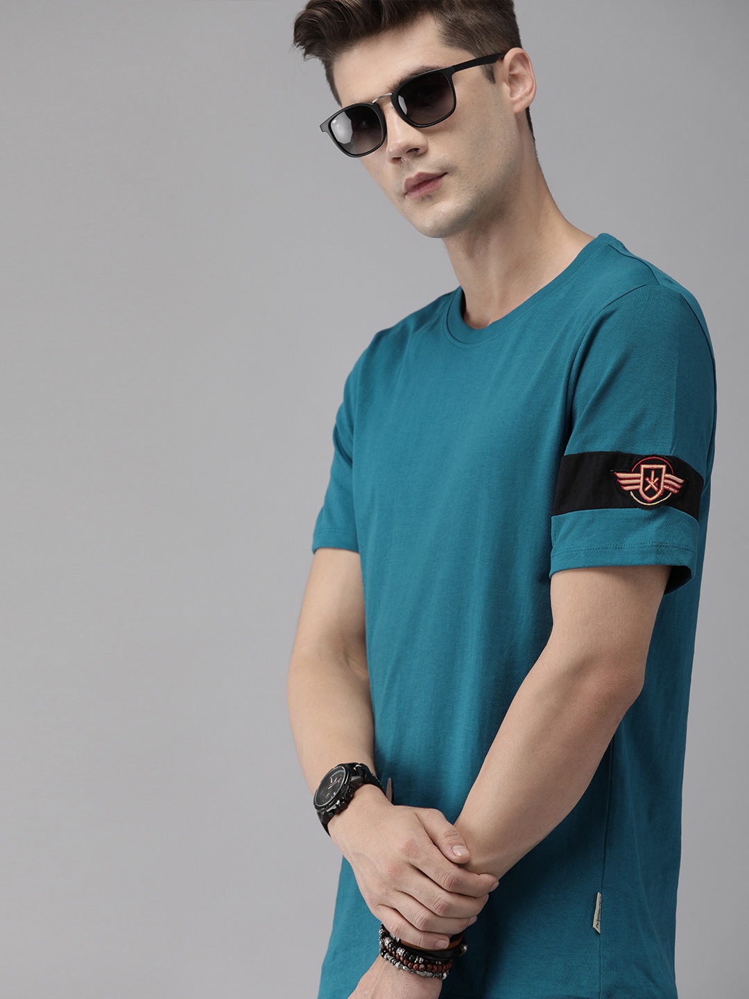 

The Roadster Lifestyle Co Men Teal Blue Solid Round Neck Pure Cotton T-shirt