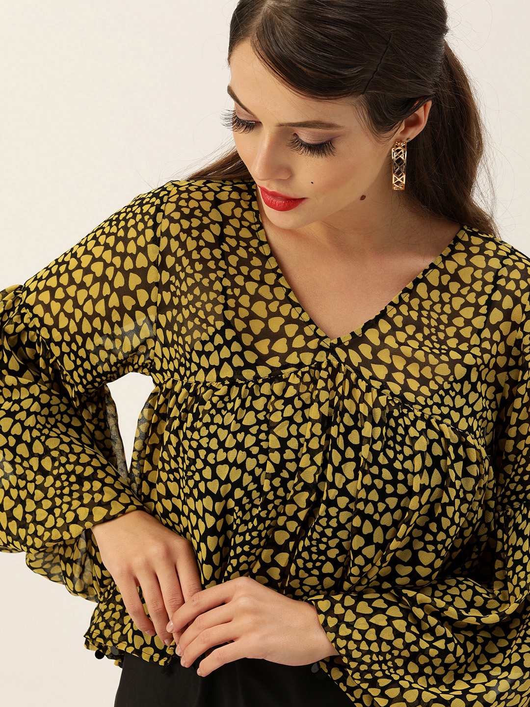 

Antheaa Women Black & Mustard Orange Geometric Printed High-low Crop Top