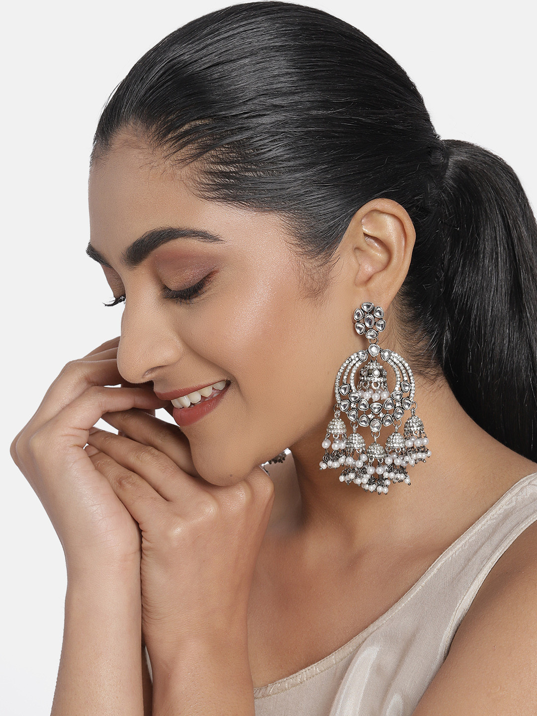 

Zaveri Pearls Antique Silver-Plated Studded Dome Shaped Jhumkas