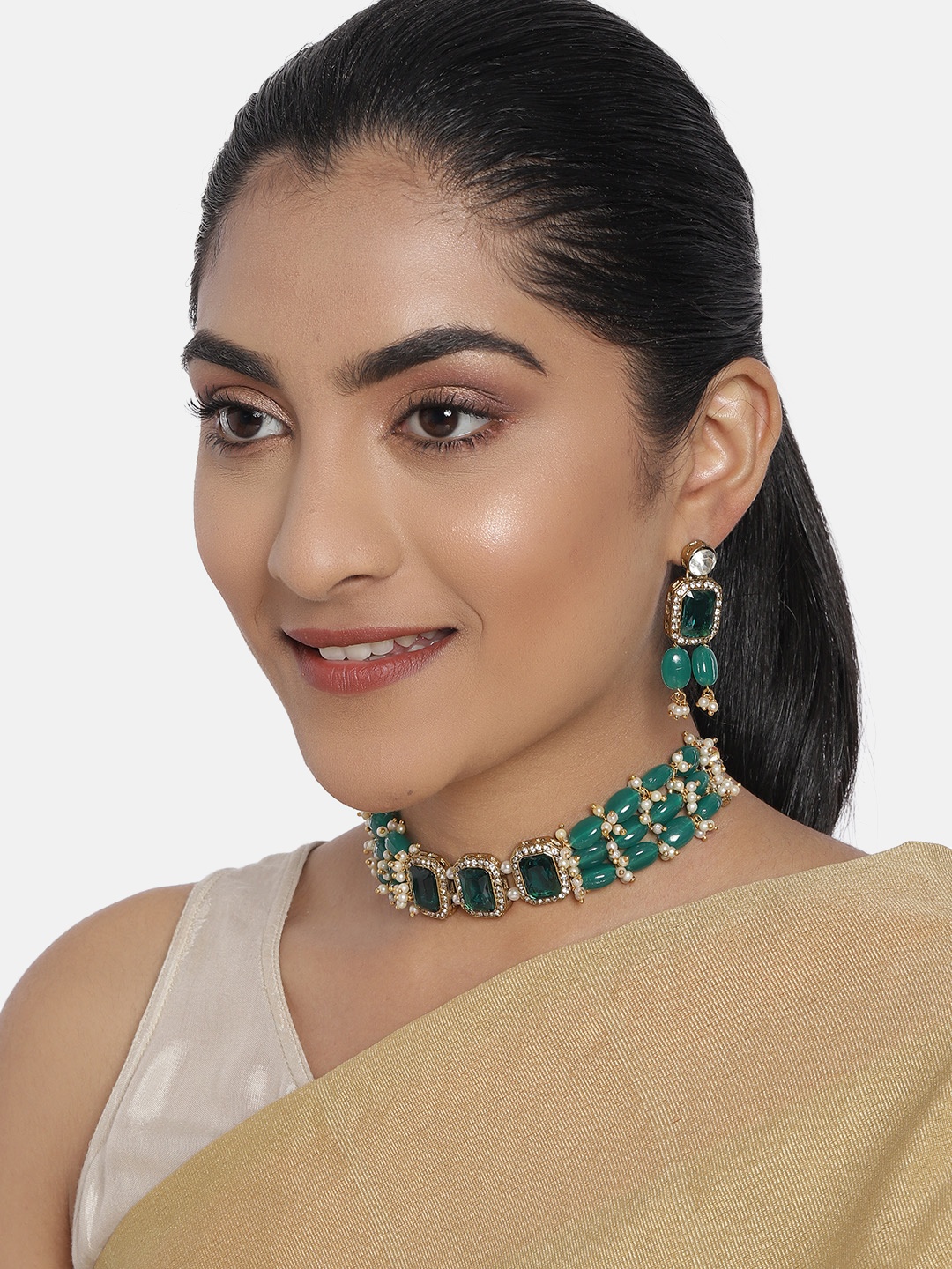 

Zaveri Pearls Green Gold-Plated Stone Studded & Beaded Jewellery Set