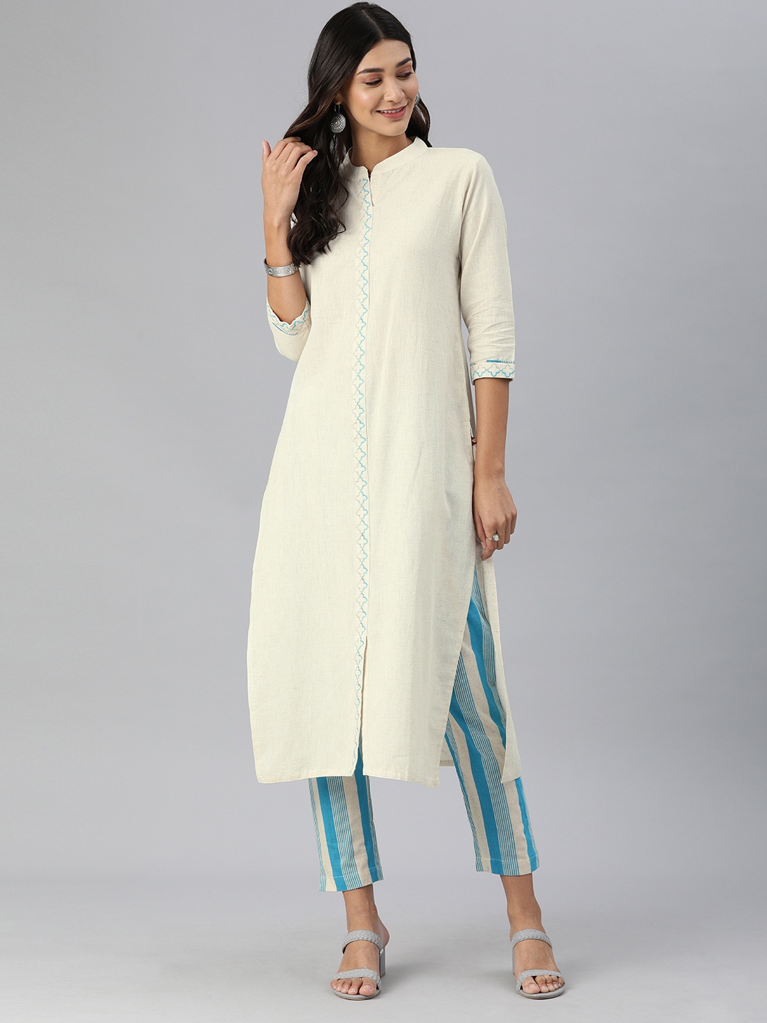 

KSUT Women Off-White & Blue Embroidered Detail Kurta with Striped Trousers