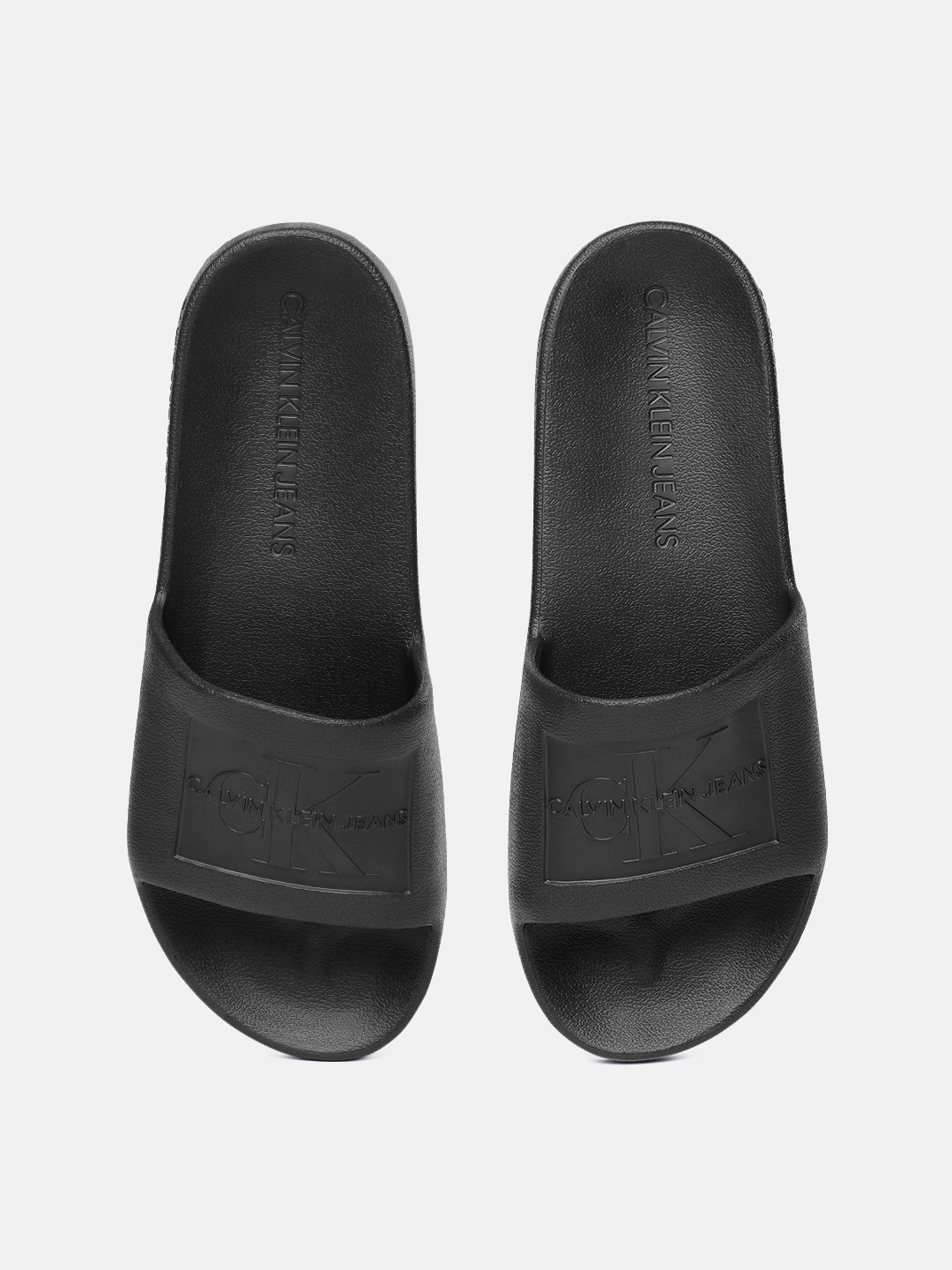 

Calvin Klein Men Black Self Design Sliders