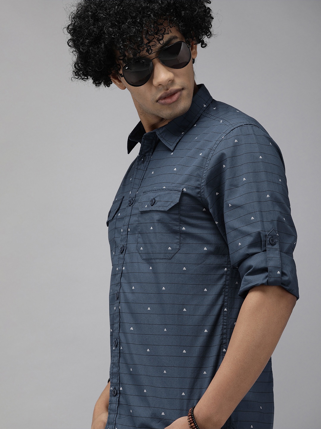 

The Roadster Lifestyle Co Men Navy Blue Striped Casual Shirt